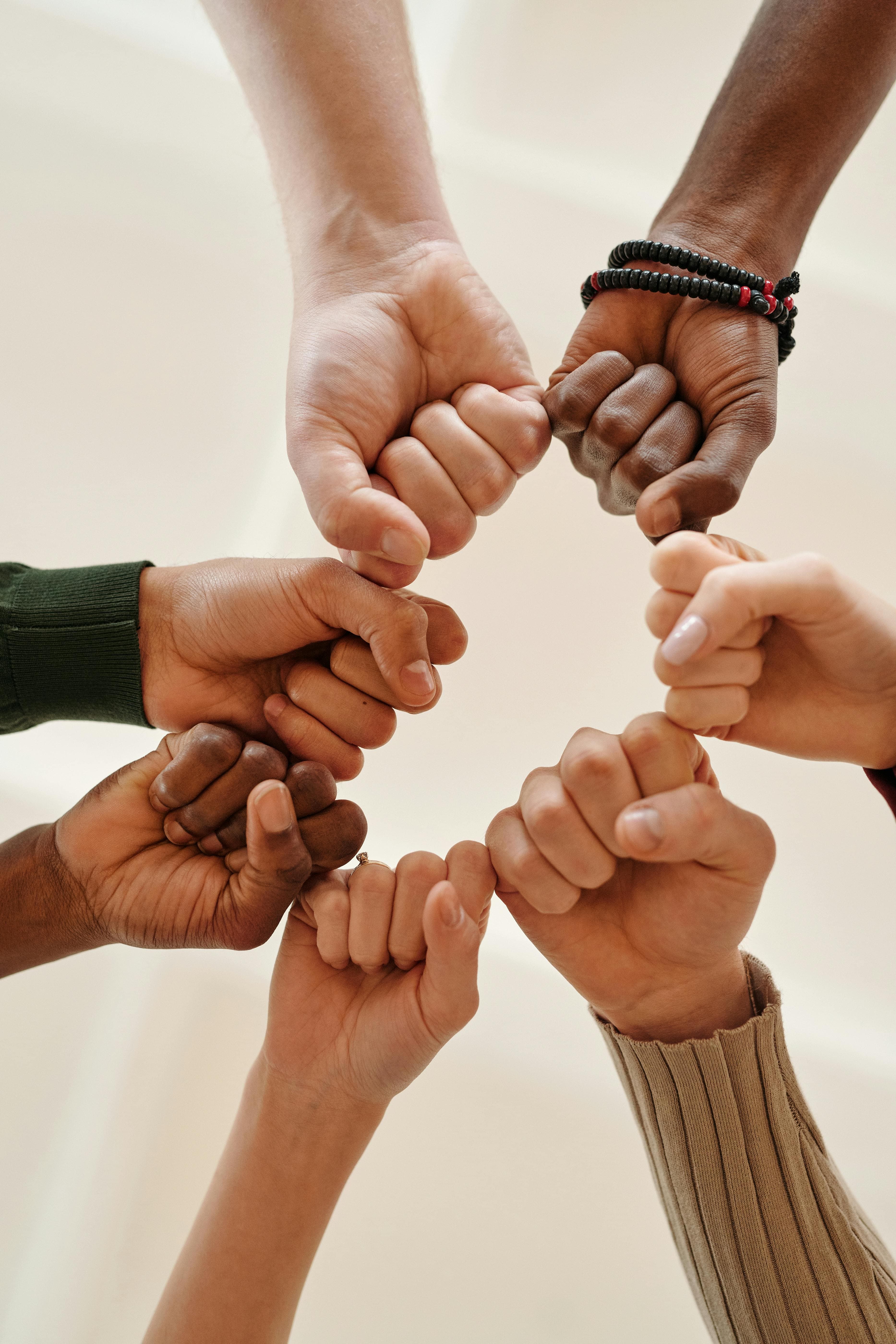 fists in a circle.