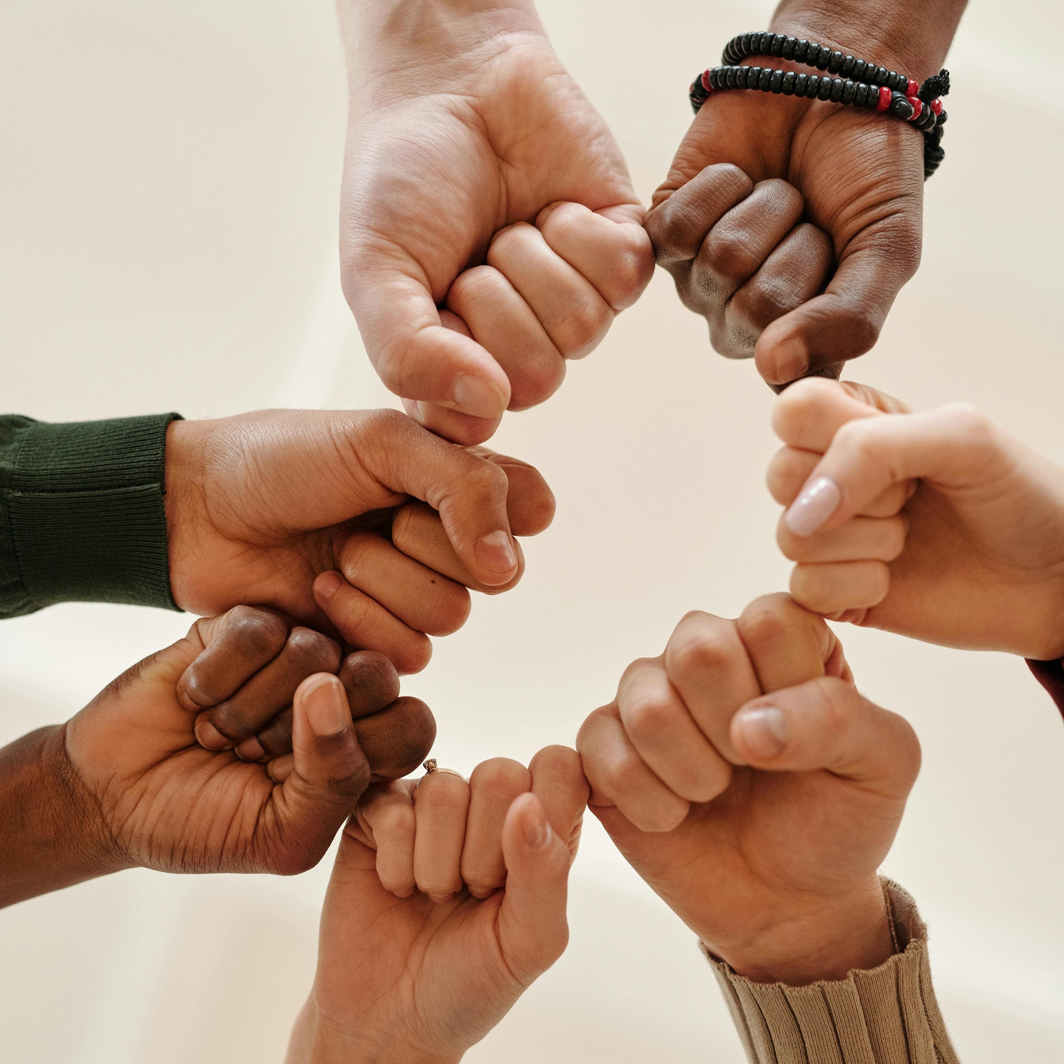 seven fists in a circle.